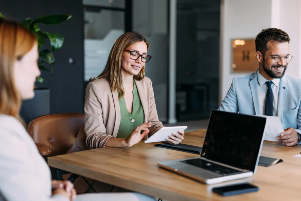 businesswoman with her colleagues on meeting in board room.